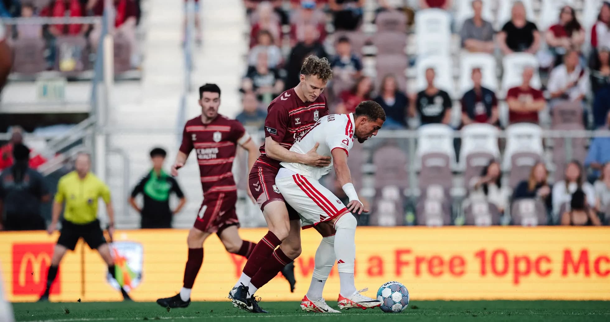Players competing for the ball in USL match Players competing for the ball in USL match