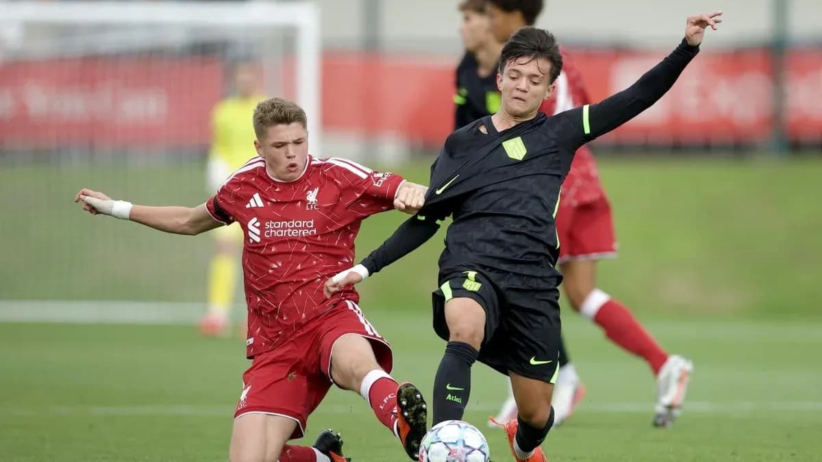 Two players contesting the ball during a match Two players contesting the ball during a match