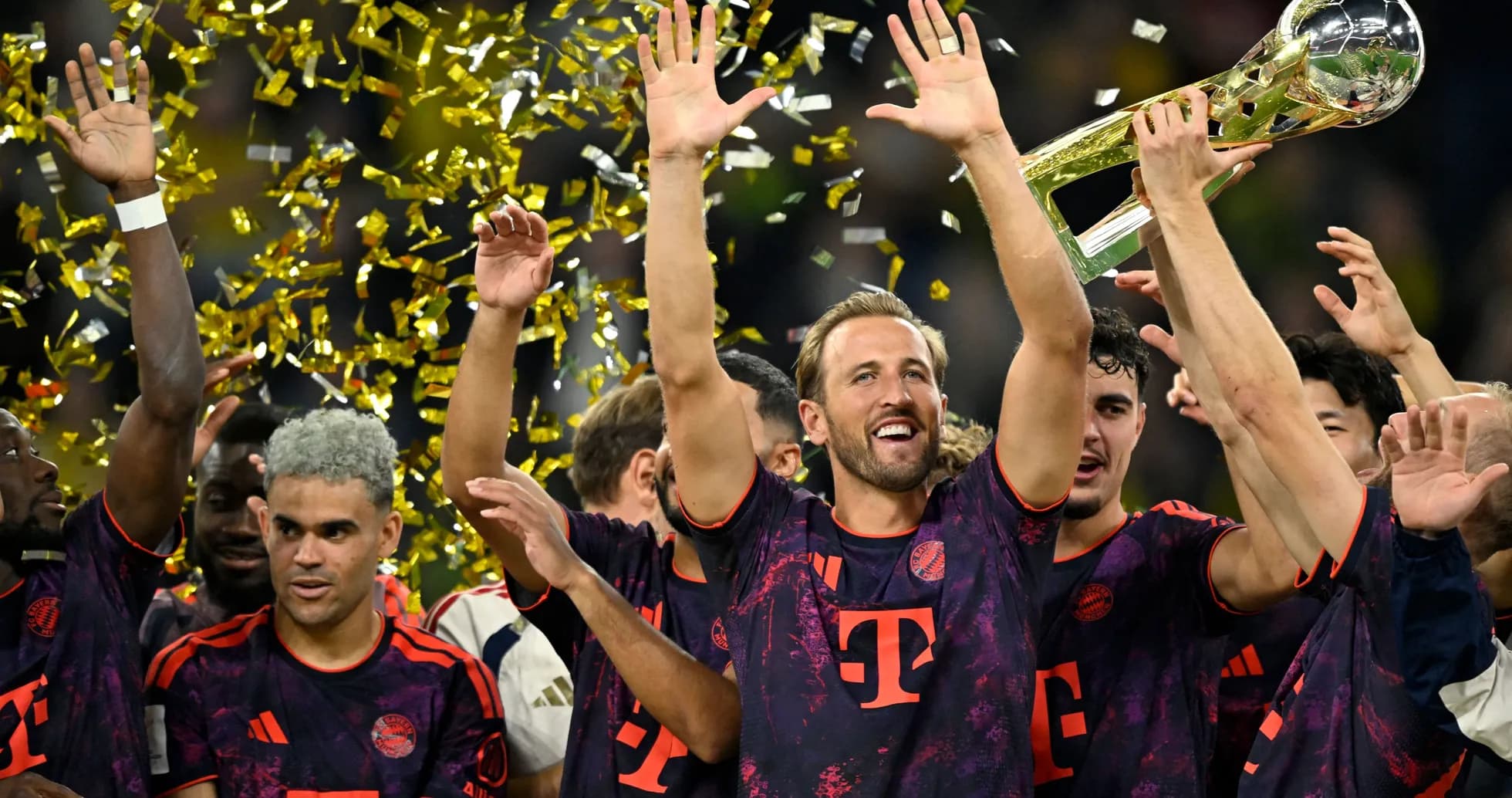 Bayern Munich players celebrating trophy victory with confetti Bayern Munich players celebrating trophy victory with confetti
