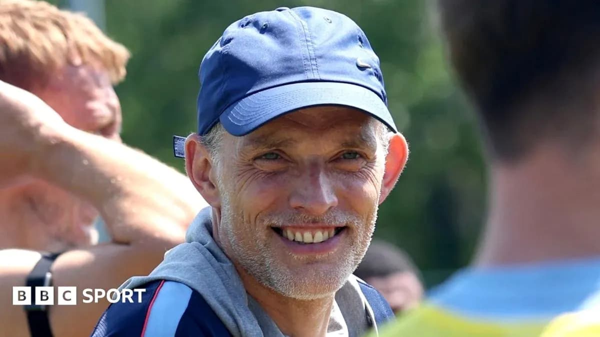 Coach smiling during training session with players Coach smiling during training session with players
