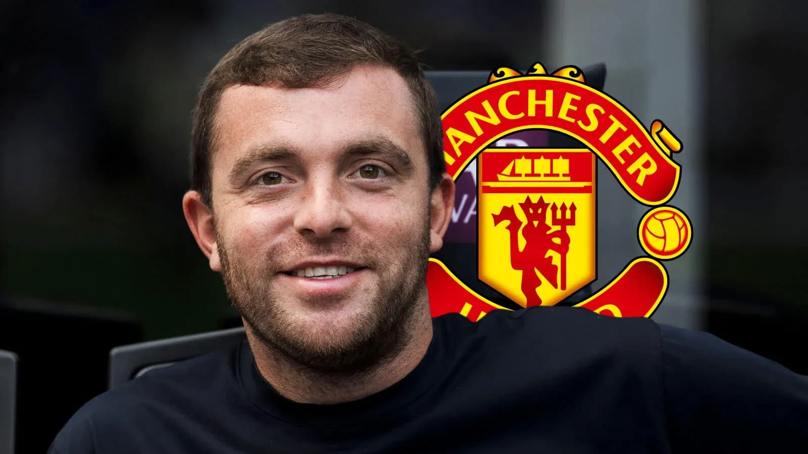 Person smiling with Manchester United logo in background Person smiling with Manchester United logo in background