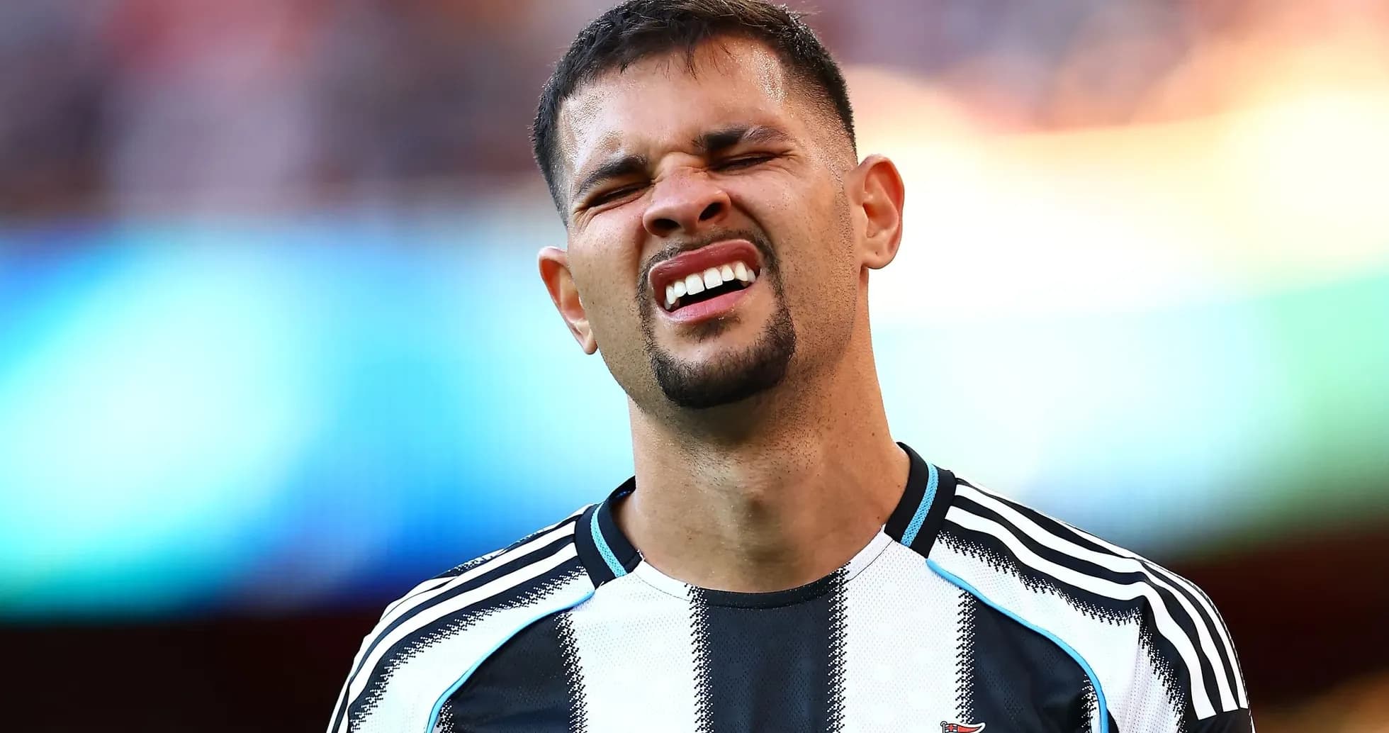 Player grimacing on the field during match Player grimacing on the field during match