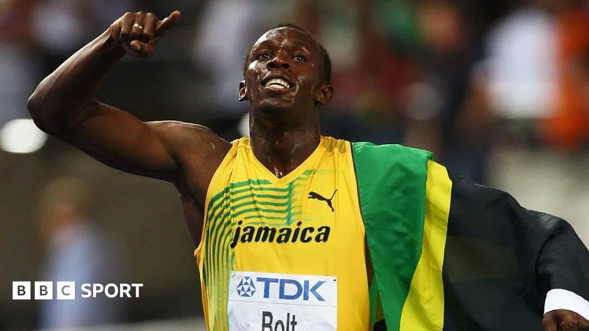 Athlete celebrating victory wearing Jamaican flag Athlete celebrating victory wearing Jamaican flag