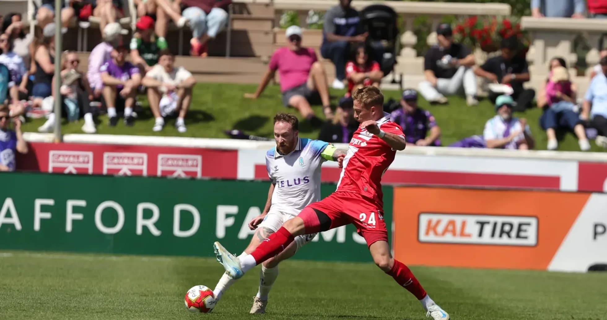Pacific FC player challenges Cavalry FC opponent Pacific FC player challenges Cavalry FC opponent