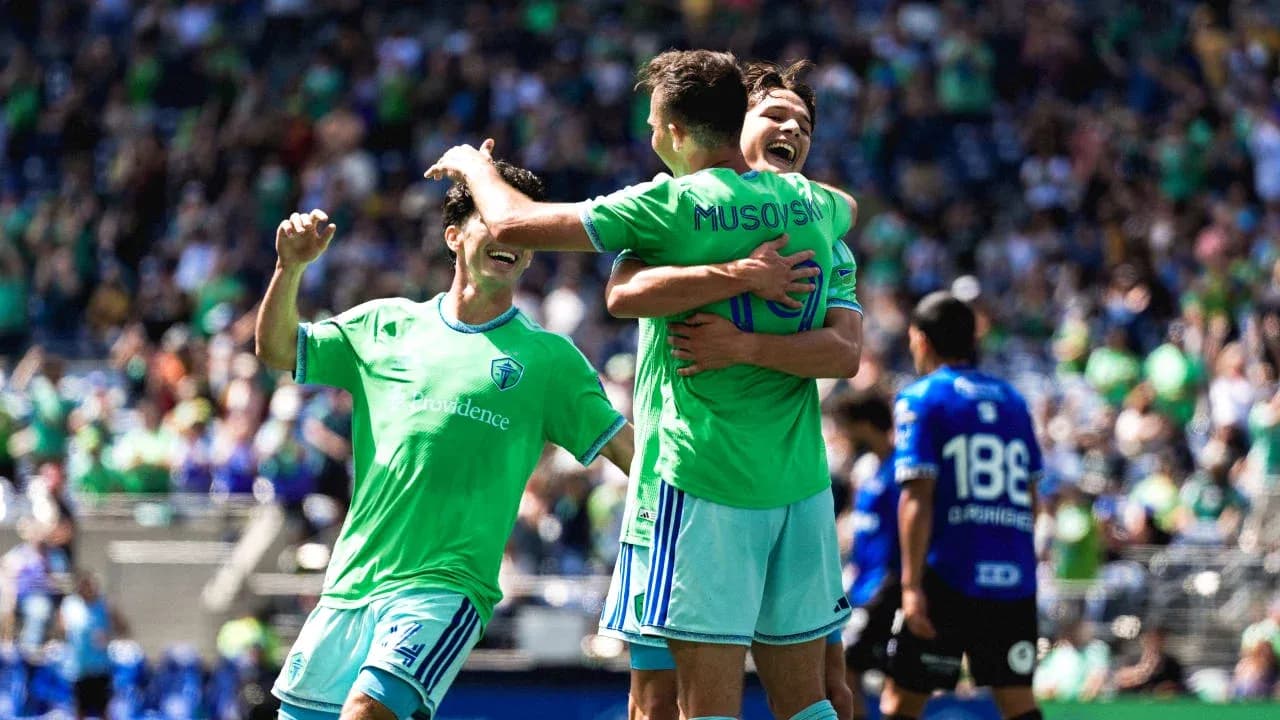 Seattle Sounders players celebrating a goal Seattle Sounders players celebrating a goal
