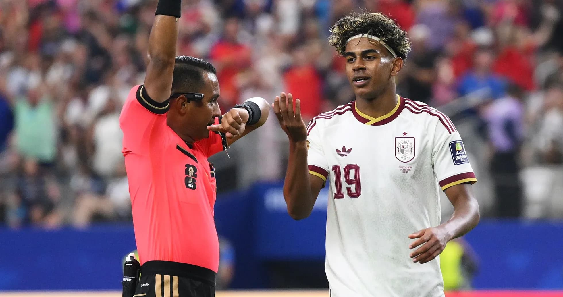 Referee showing card to player during match Referee showing card to player during match