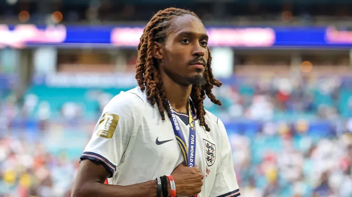 Player wearing England jersey with medal walking on field Player wearing England jersey with medal walking on field
