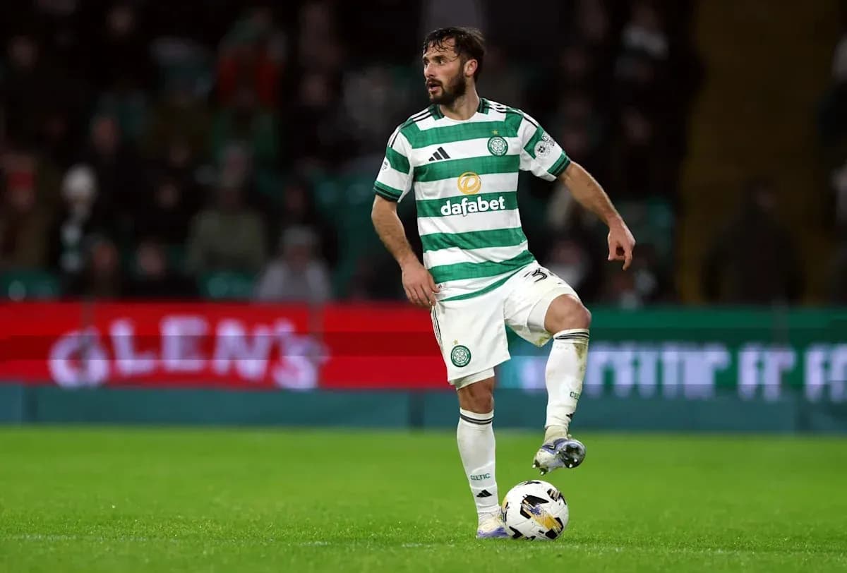 Celtic player controlling the ball during match Celtic player controlling the ball during match