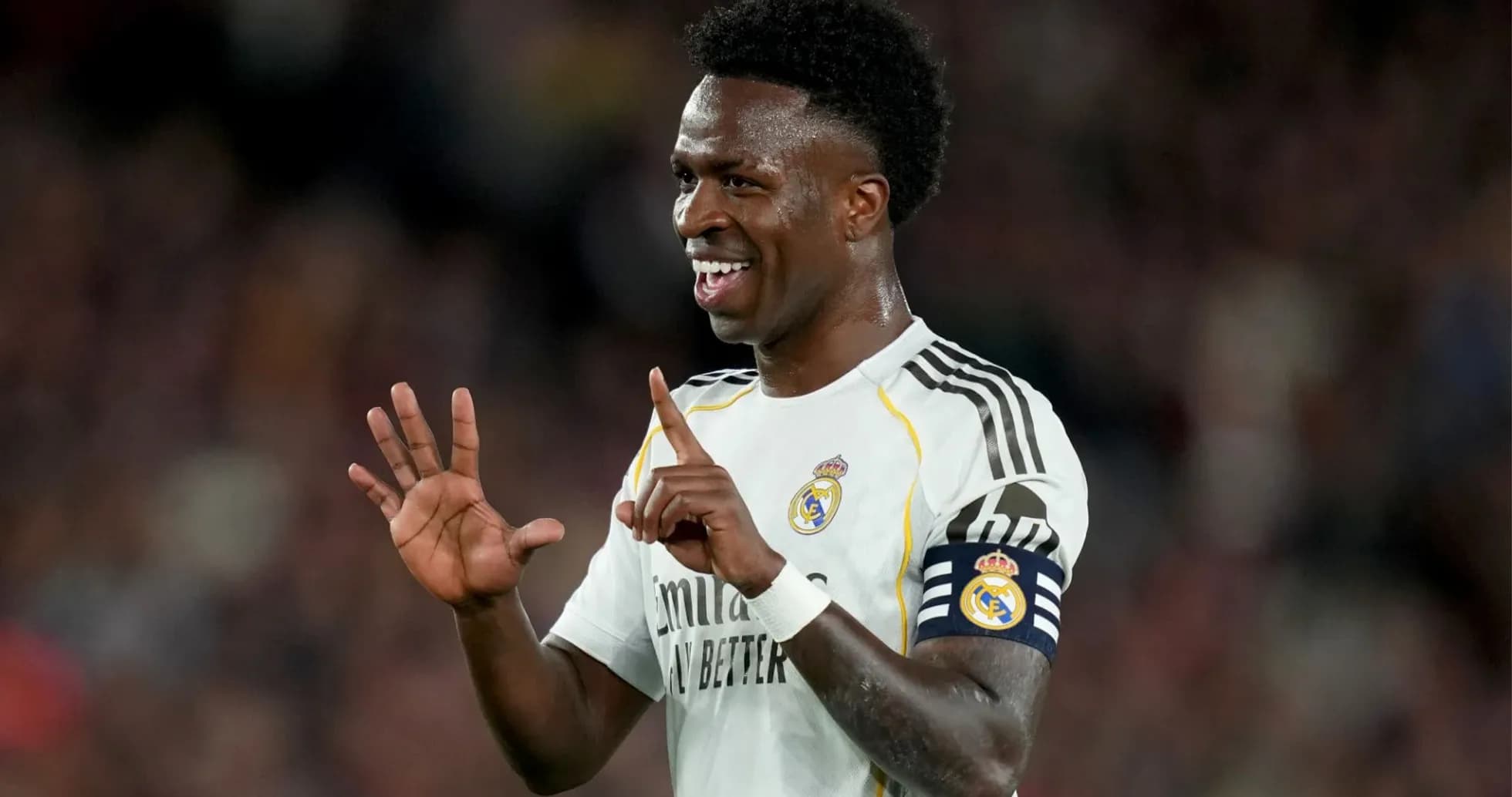 Player celebrating with fingers raised during match Player celebrating with fingers raised during match