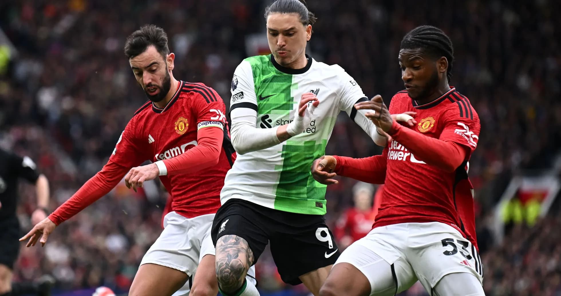 Players contesting the ball during Liverpool vs Manchester United Players contesting the ball during Liverpool vs Manchester United