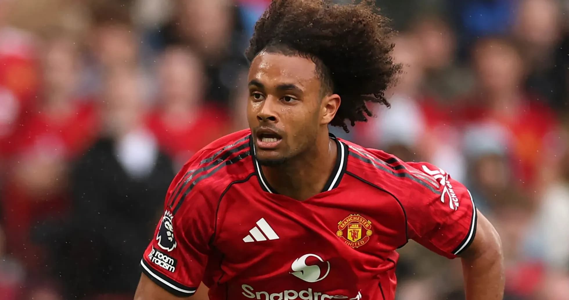 Player sprinting in Manchester United red jersey Player sprinting in Manchester United red jersey