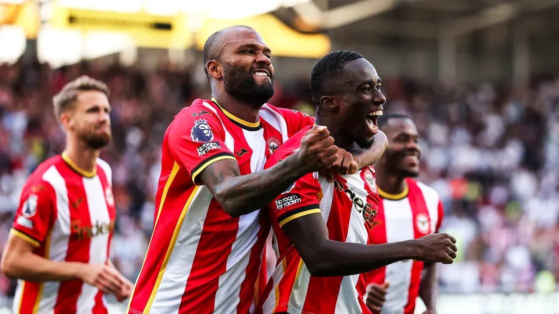 Brentford players celebrating a goal together Brentford players celebrating a goal together