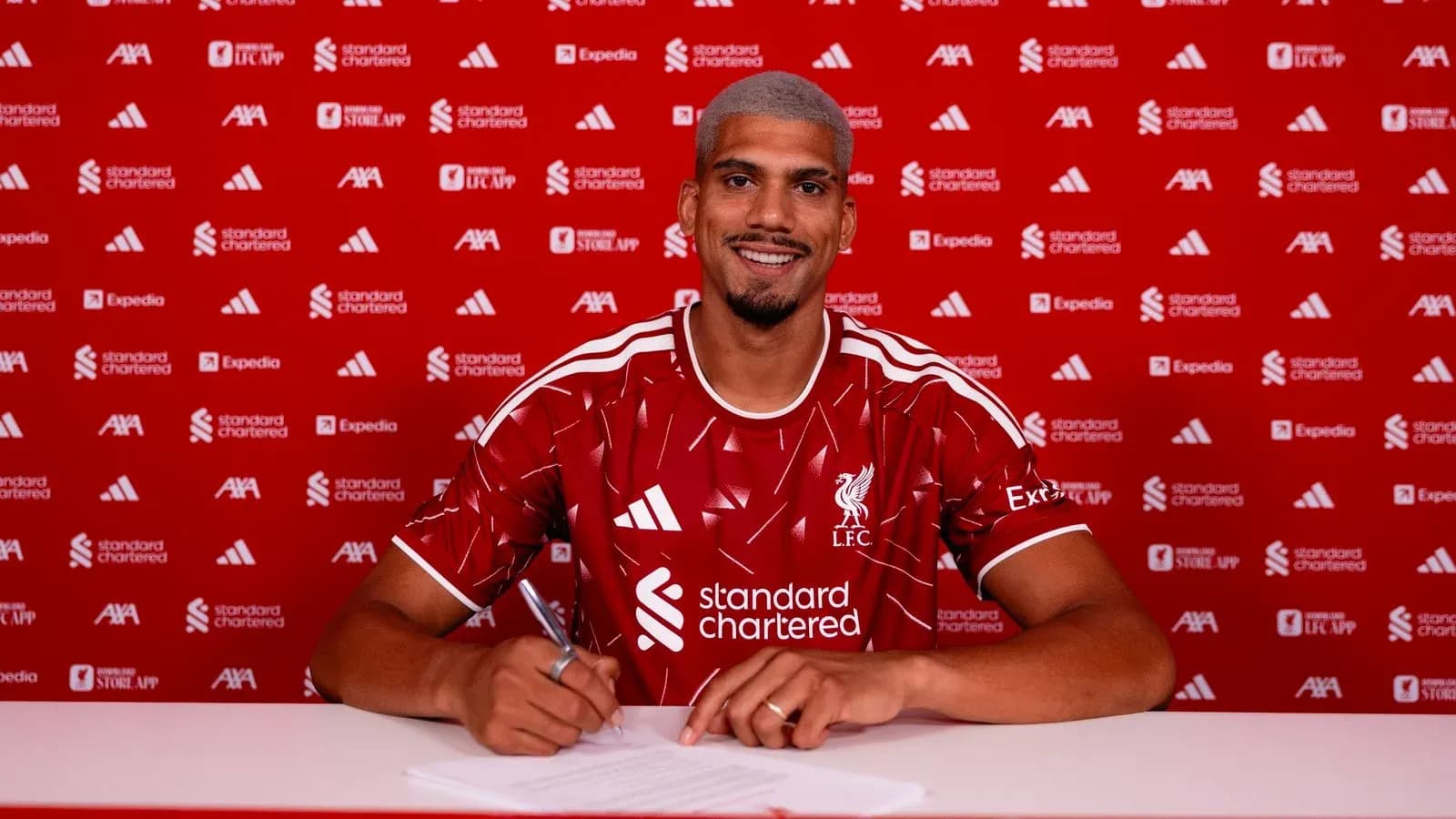 Player signing contract at Liverpool FC announcement event Player signing contract at Liverpool FC announcement event