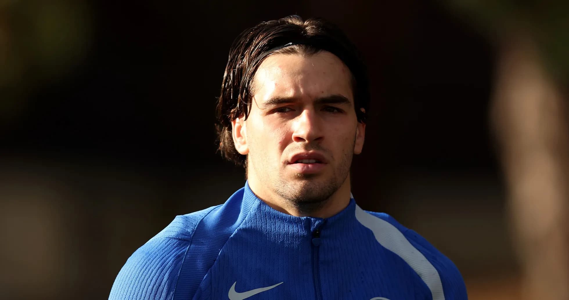 Football player in blue training kit looking forward Football player in blue training kit looking forward