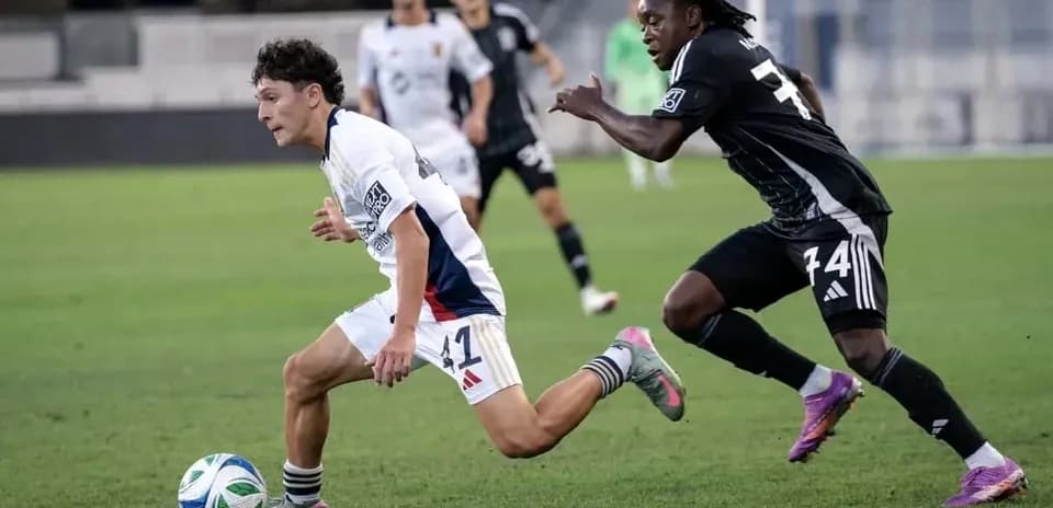 Player dribbling the ball during MLS Next Pro match Player dribbling the ball during MLS Next Pro match