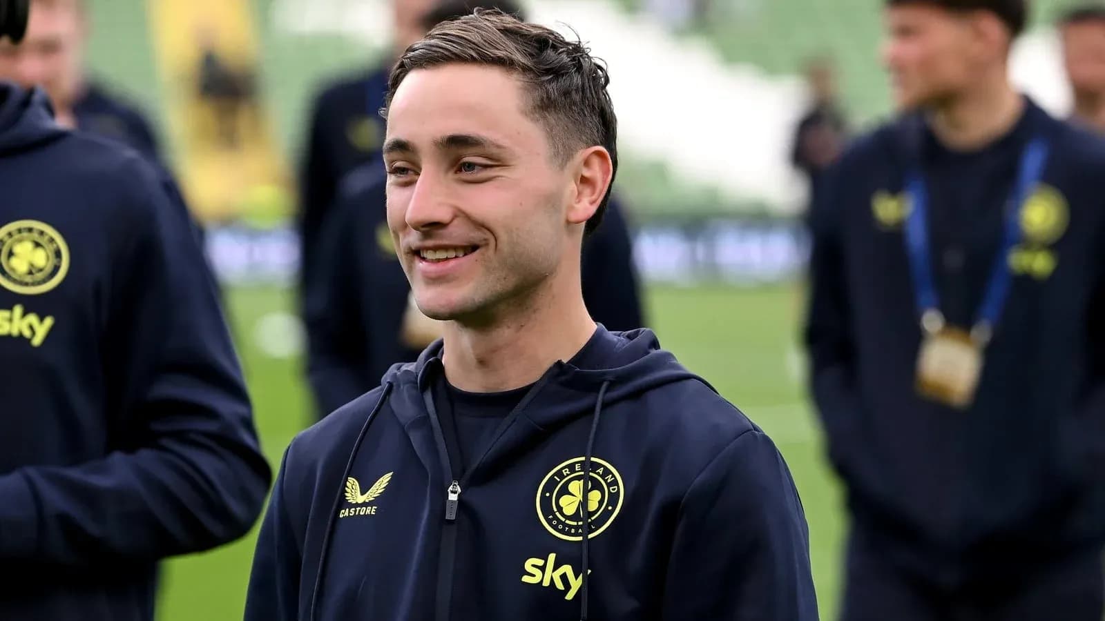 Player smiling during warm-up on the pitch Player smiling during warm-up on the pitch