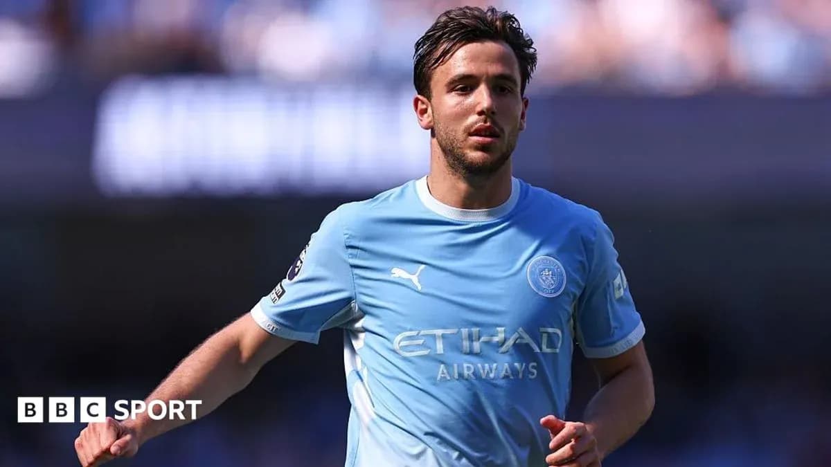 Player in light blue jersey running on the field Player in light blue jersey running on the field