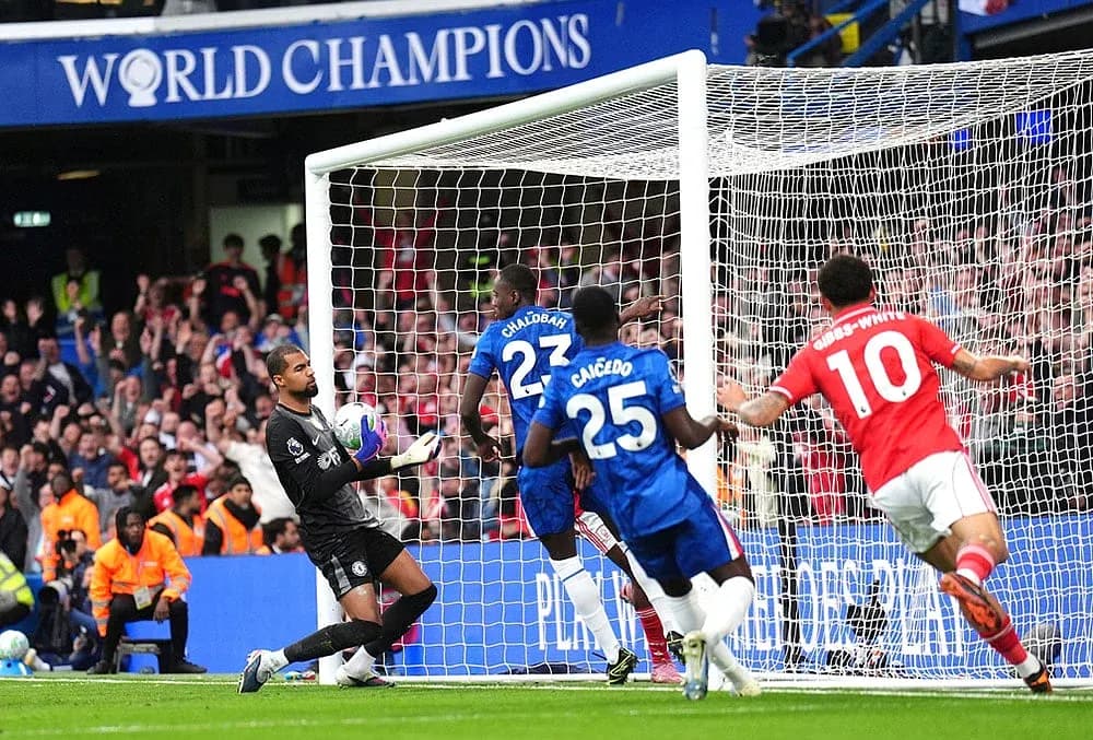 Chelsea goalkeeper saves shot during match Chelsea goalkeeper saves shot during match