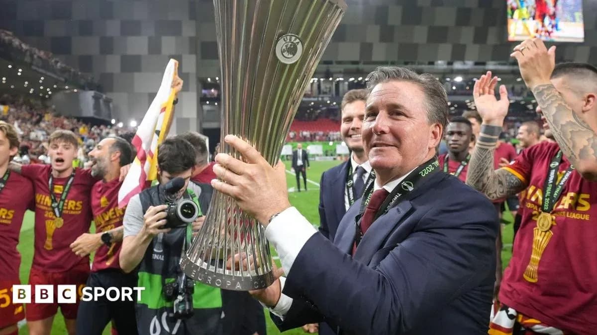 Coach celebrating with UEFA Europa Conference League trophy Coach celebrating with UEFA Europa Conference League trophy