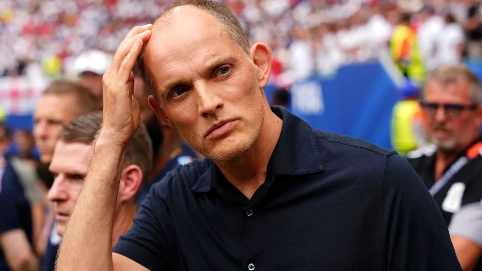 Coach observing match with concerned expression Coach observing match with concerned expression