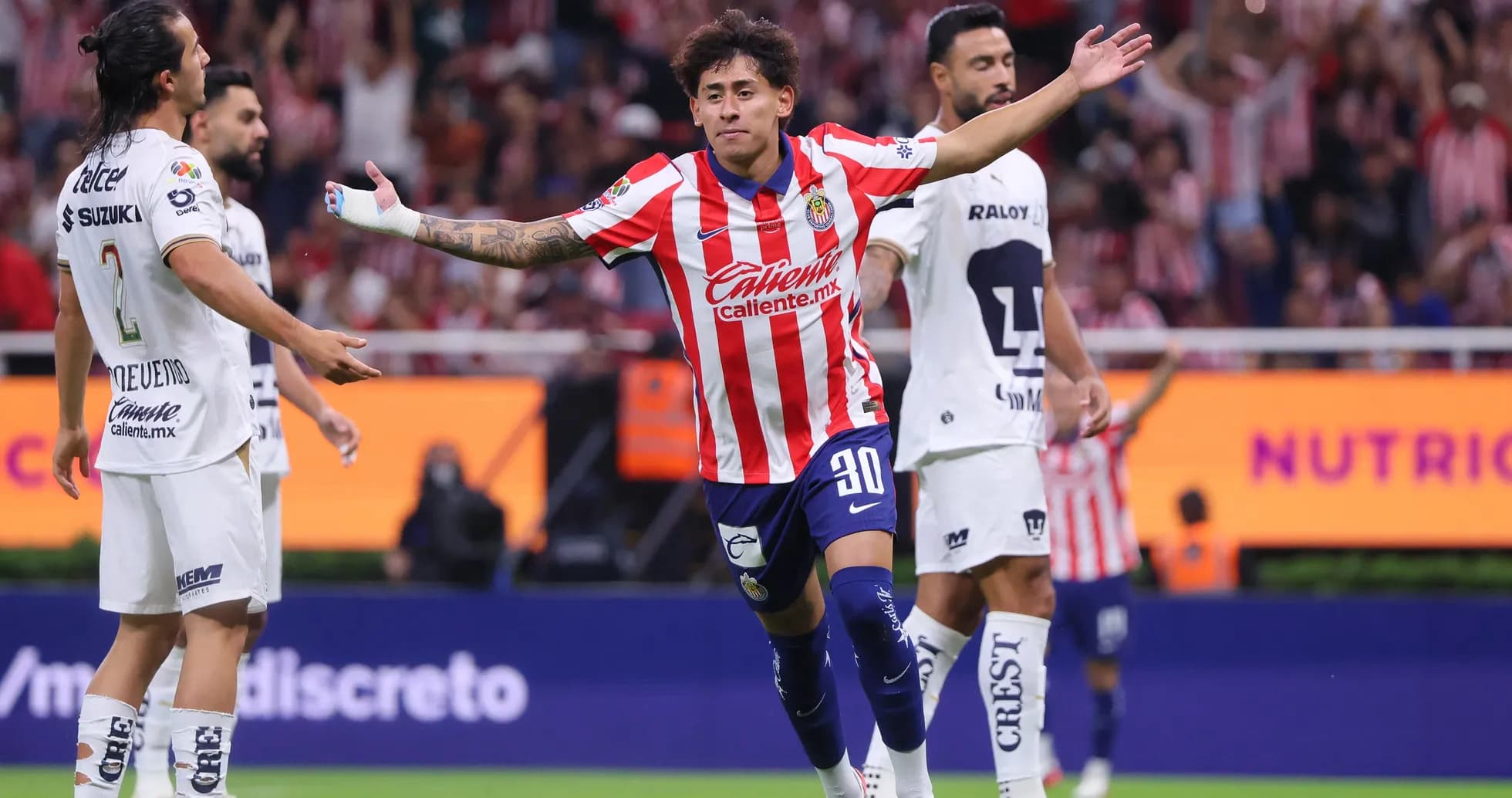 Chivas player celebrating goal against Pumas Chivas player celebrating goal against Pumas