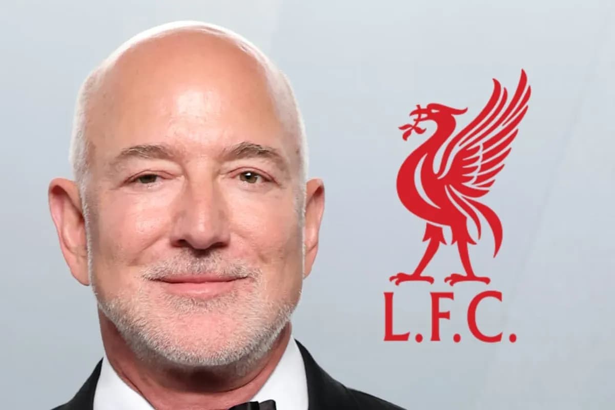 Man in tuxedo with Liverpool FC logo background Man in tuxedo with Liverpool FC logo background