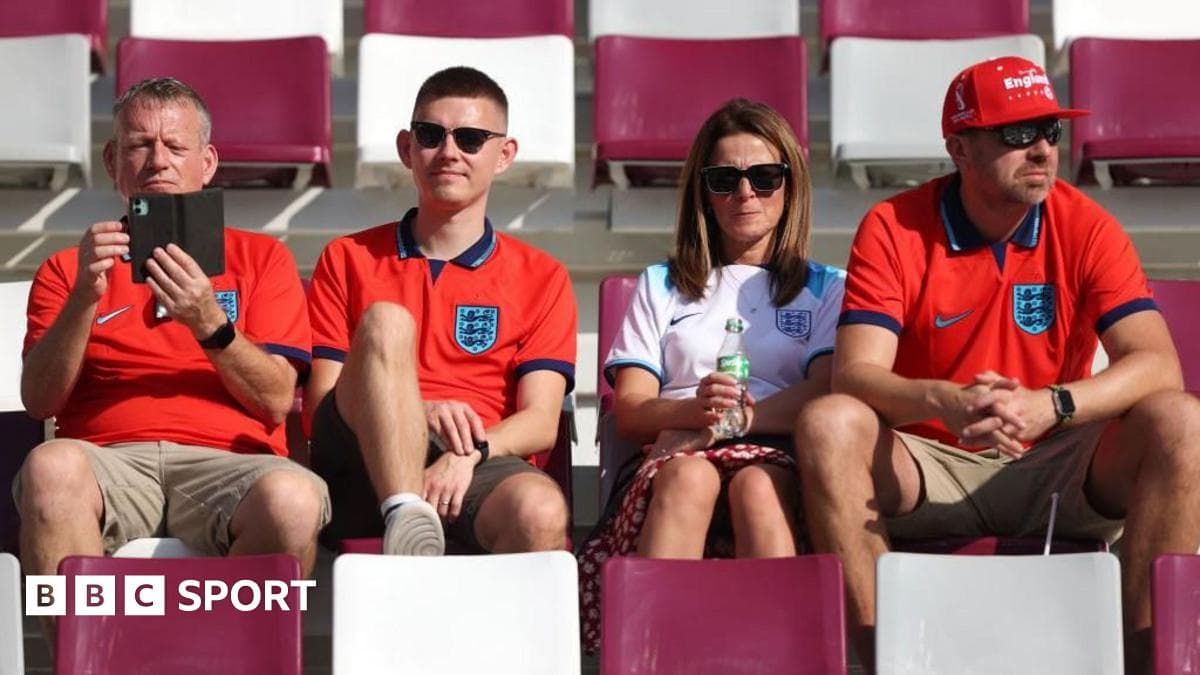 Fans wearing England shirts sitting in stadium Fans wearing England shirts sitting in stadium