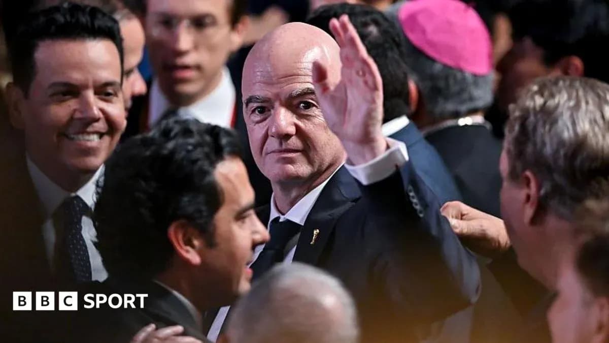 Man waving at an event surrounded by attendees Man waving at an event surrounded by attendees