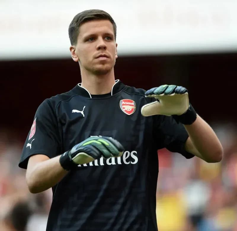 Goalkeeper warming up before match in Arsenal kit Goalkeeper warming up before match in Arsenal kit