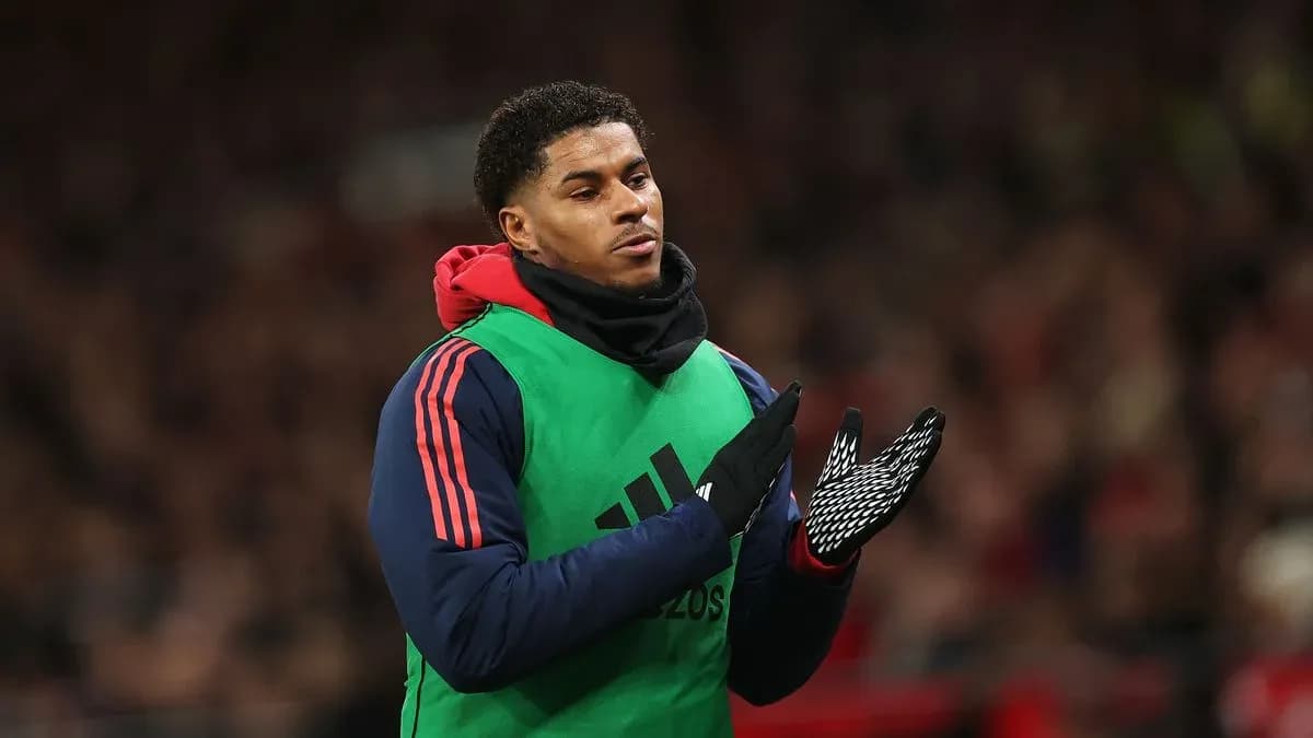 Player applauding while wearing training gear on sideline Player applauding while wearing training gear on sideline