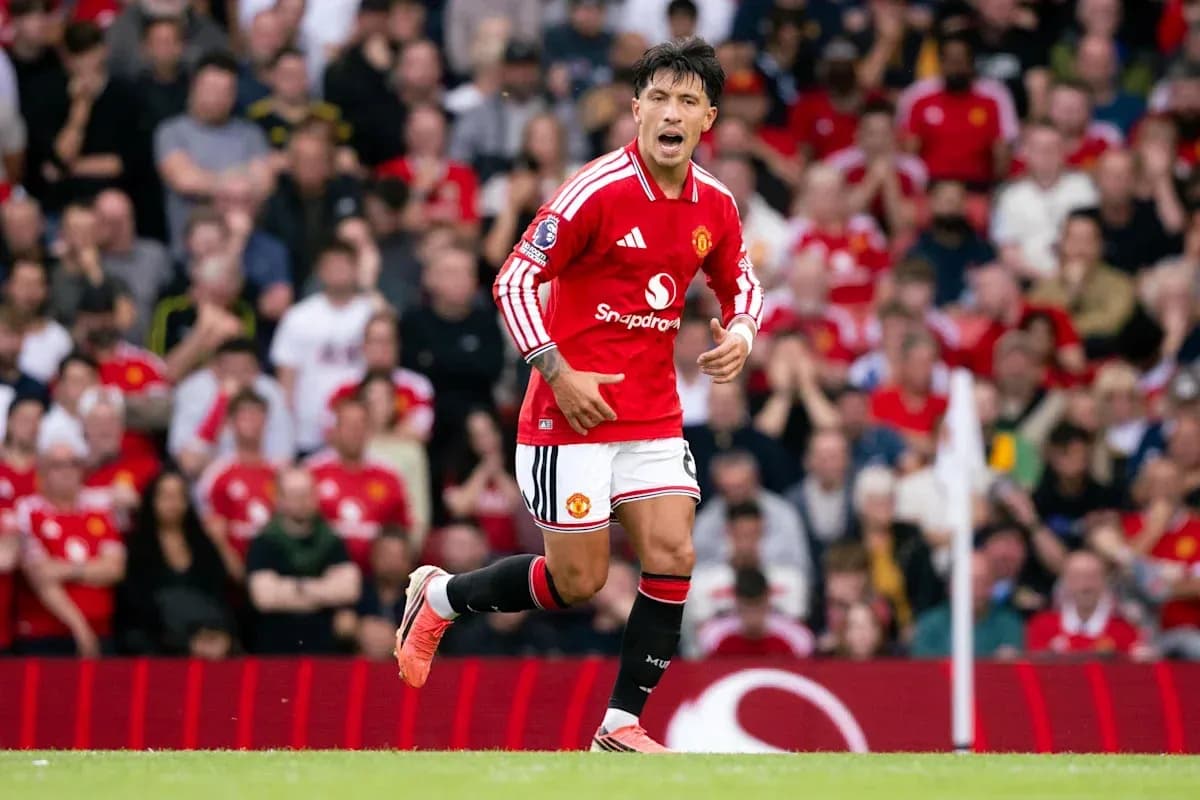 Player celebrating in Manchester United kit on field Player celebrating in Manchester United kit on field