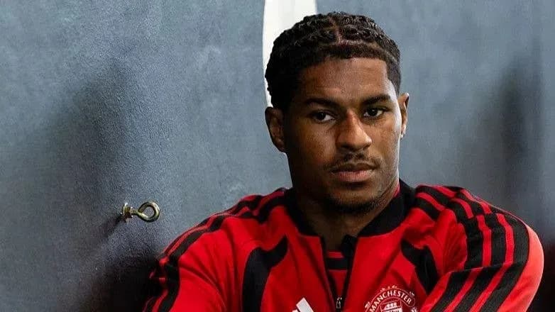 Player in Manchester United training kit posing Player in Manchester United training kit posing