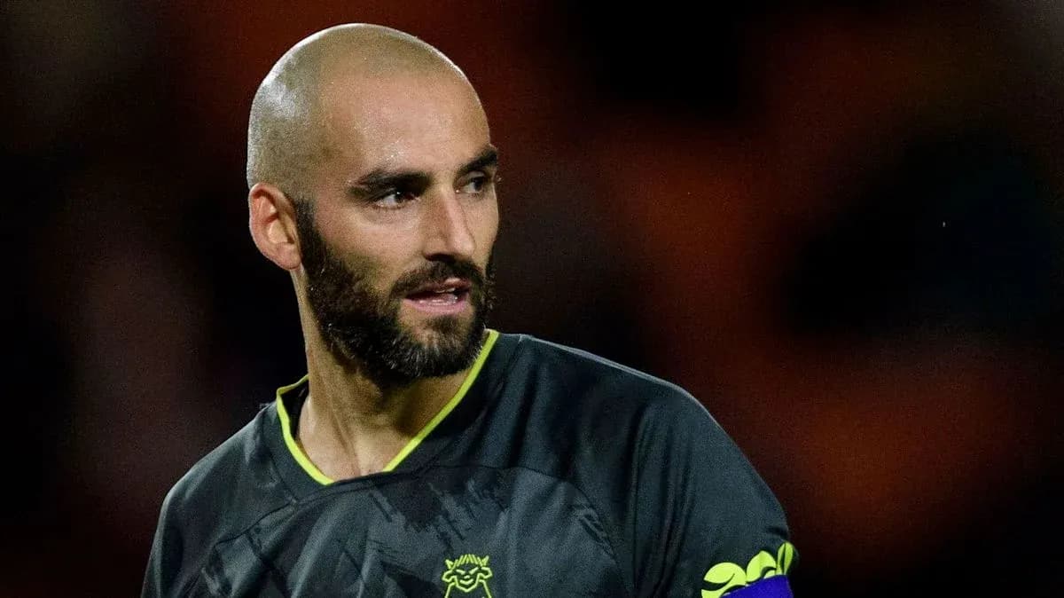 Goalkeeper wearing a dark jersey during match Goalkeeper wearing a dark jersey during match