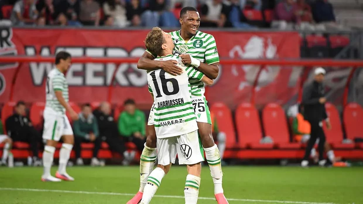 Players celebrating during a football match Players celebrating during a football match