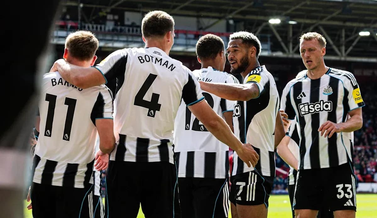Newcastle players celebrating a goal together Newcastle players celebrating a goal together
