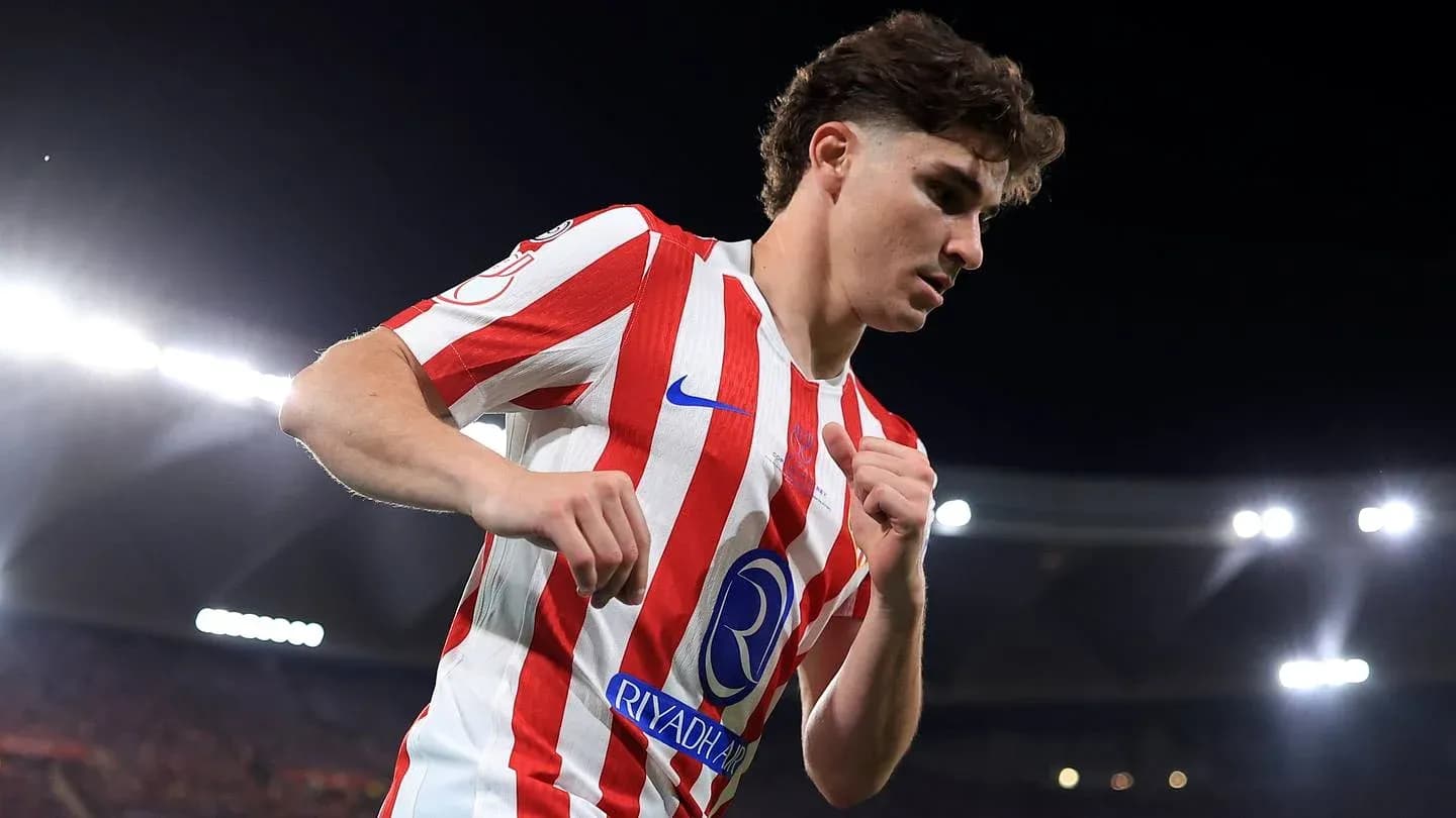 Player in red and white jersey during match Player in red and white jersey during match
