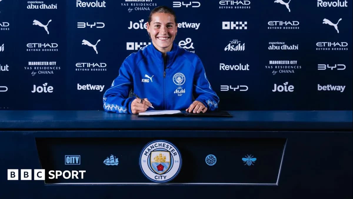Player signing contract at Manchester City press conference Player signing contract at Manchester City press conference