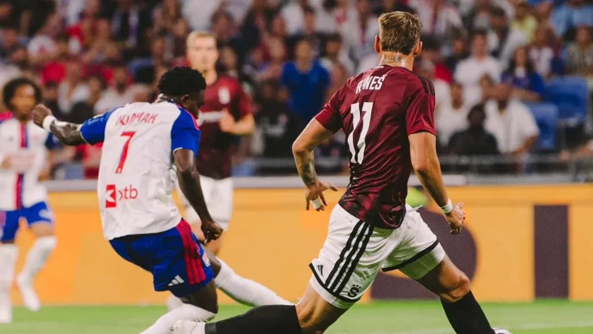 Lyon player dribbling past Sparta Praha defender Lyon player dribbling past Sparta Praha defender