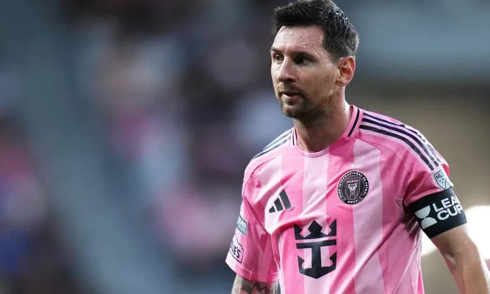 Lionel Messi in pink Inter Miami jersey on field Lionel Messi in pink Inter Miami jersey on field