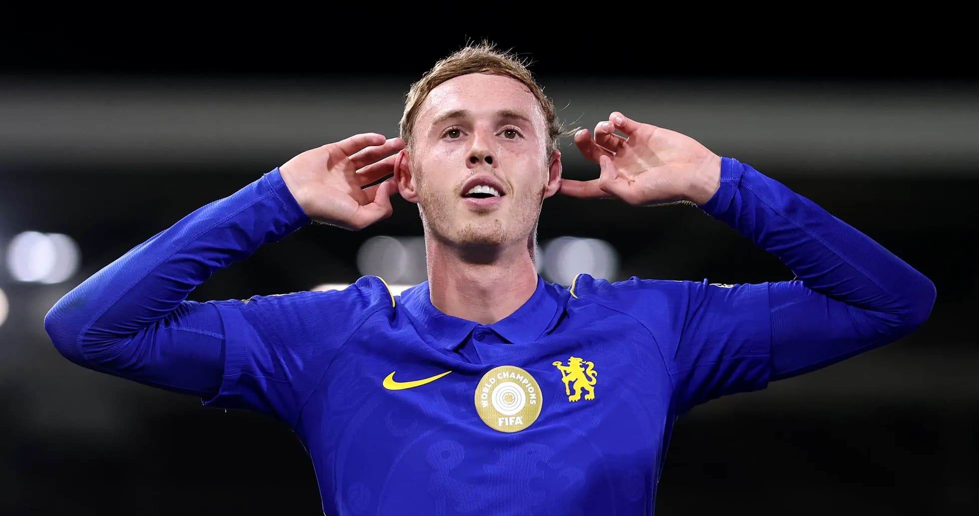 Player celebrating a goal with hands on ears Player celebrating a goal with hands on ears