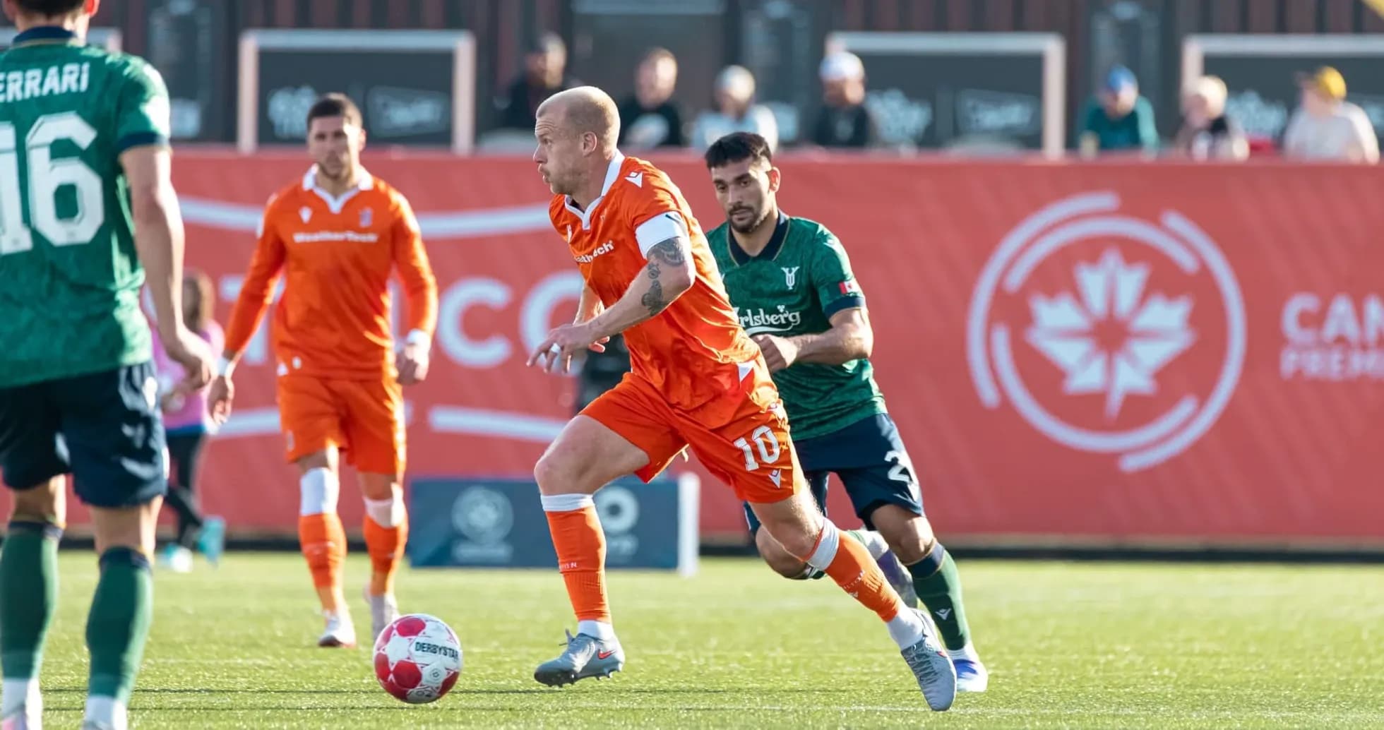 Player dribbling during Forge vs York United match Player dribbling during Forge vs York United match