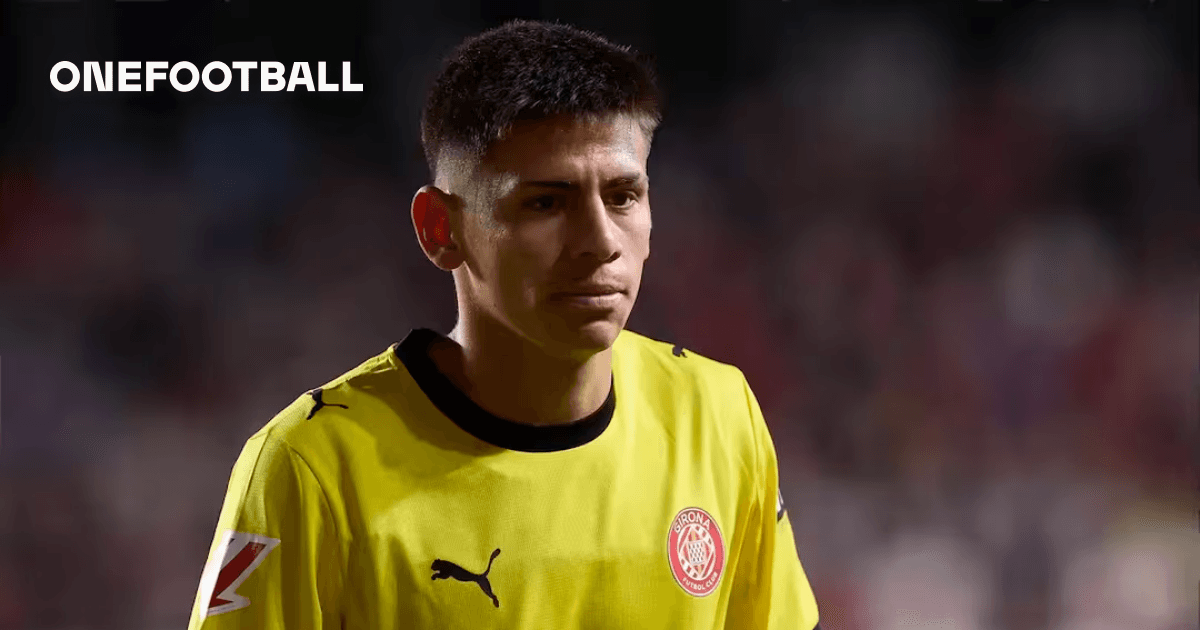 Goalkeeper in yellow jersey walking off the field Goalkeeper in yellow jersey walking off the field