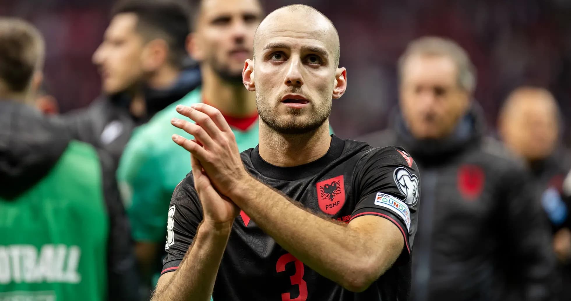 Player in Albania jersey applauding fans after match Player in Albania jersey applauding fans after match