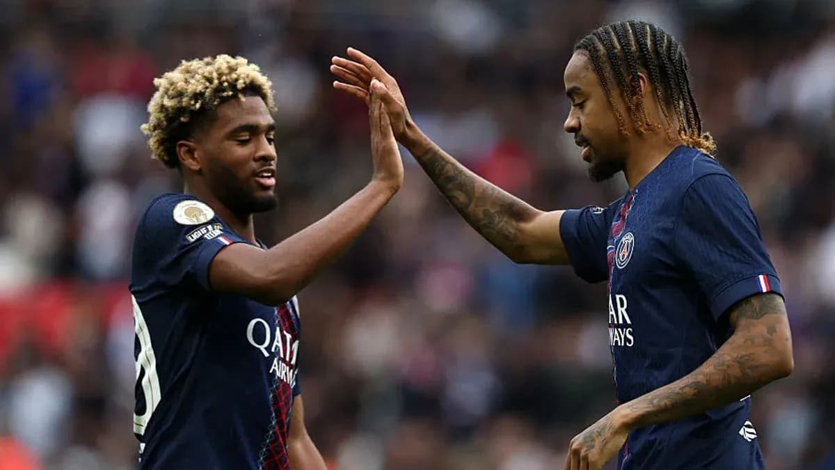 Two PSG players celebrating with a high five Two PSG players celebrating with a high five