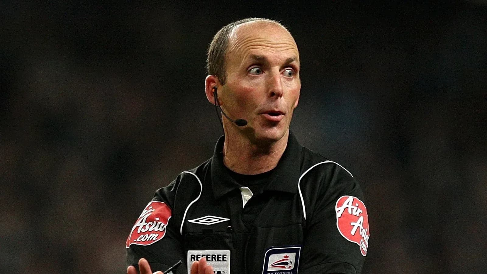 Referee signaling during a football match Referee signaling during a football match