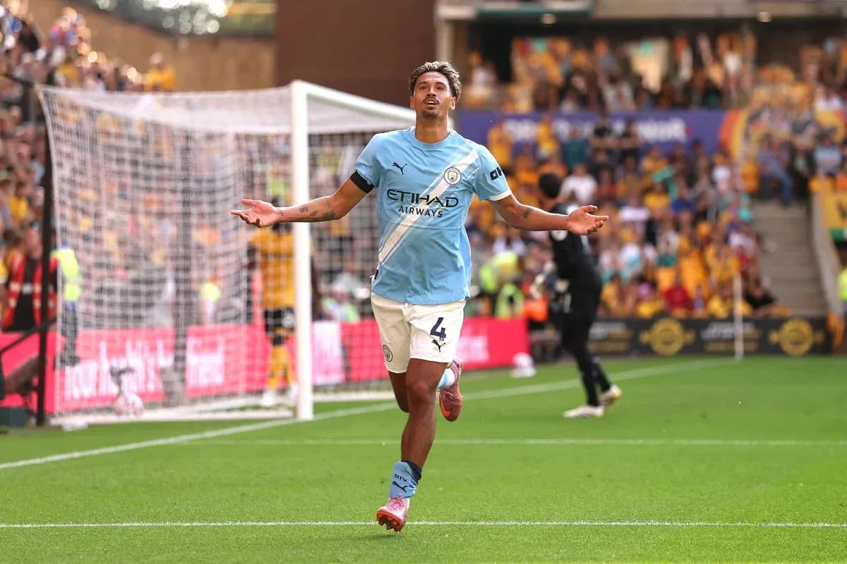 Player celebrating goal on the pitch at stadium Player celebrating goal on the pitch at stadium