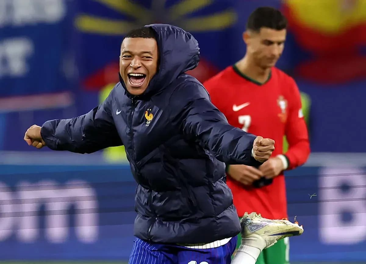 Kylian Mbappé celebrating in warm-up jacket Kylian Mbappé celebrating in warm-up jacket