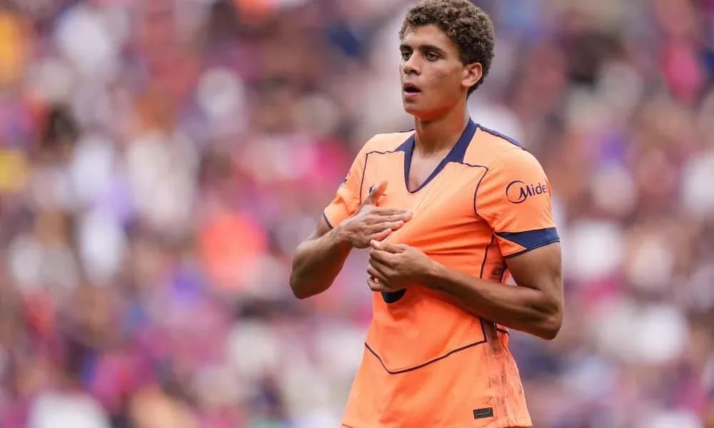 Player in orange jersey during match action Player in orange jersey during match action