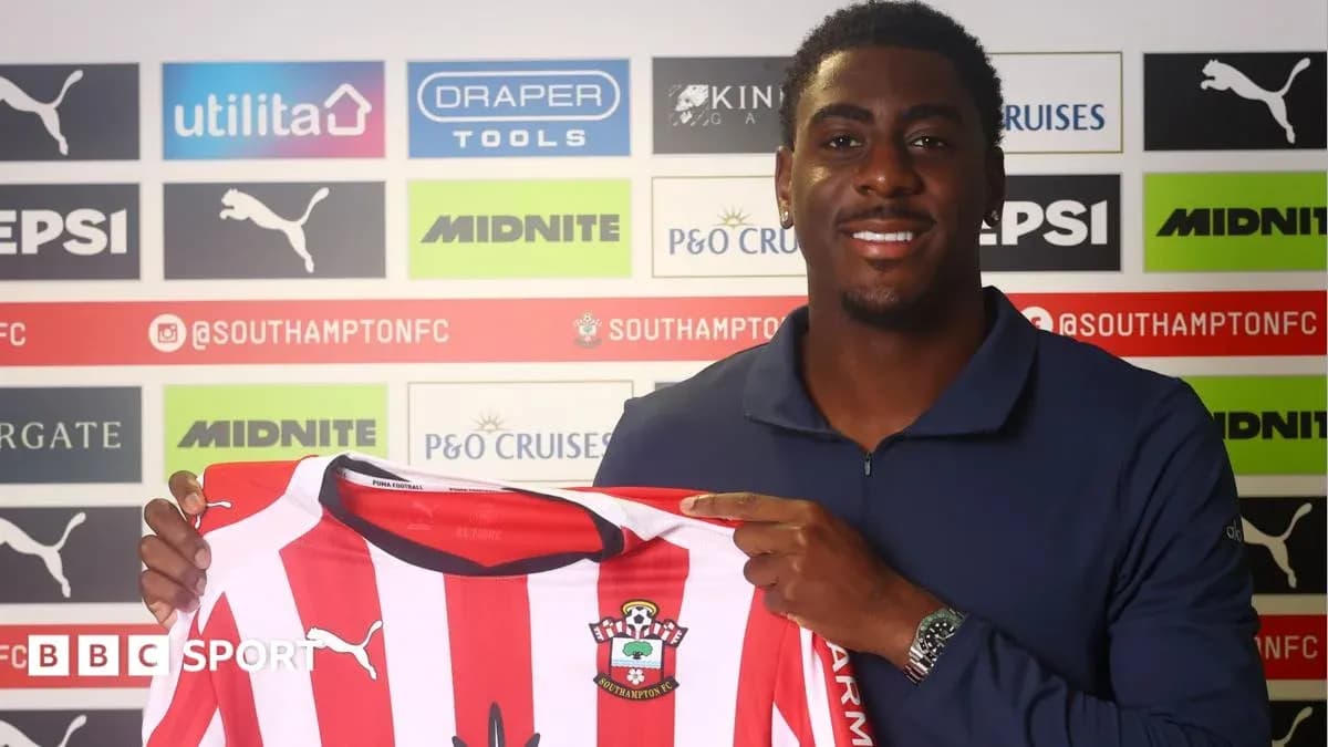Player holding Southampton FC jersey at press event Player holding Southampton FC jersey at press event