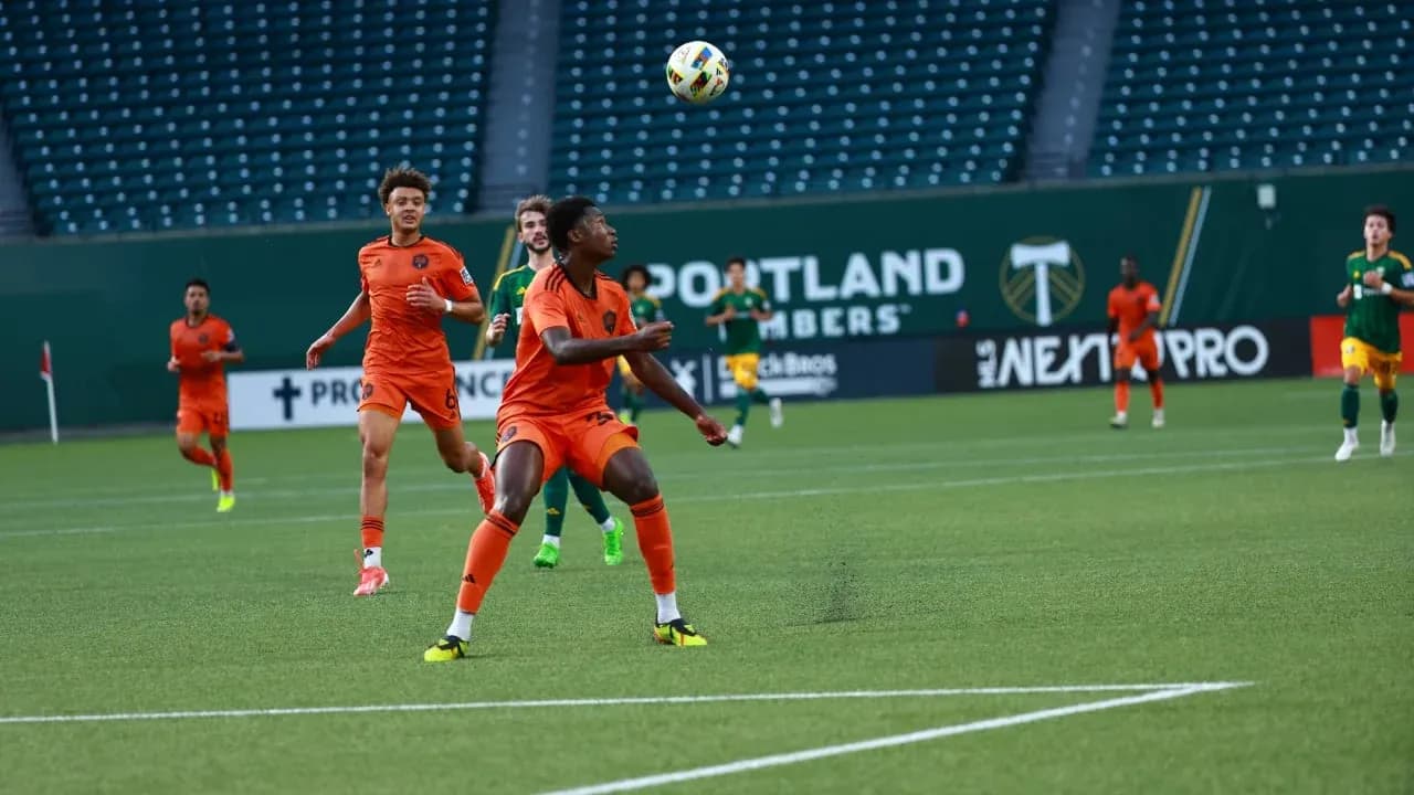 Players competing for the ball during match Players competing for the ball during match